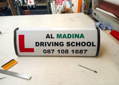 al madina driving school roofsign
